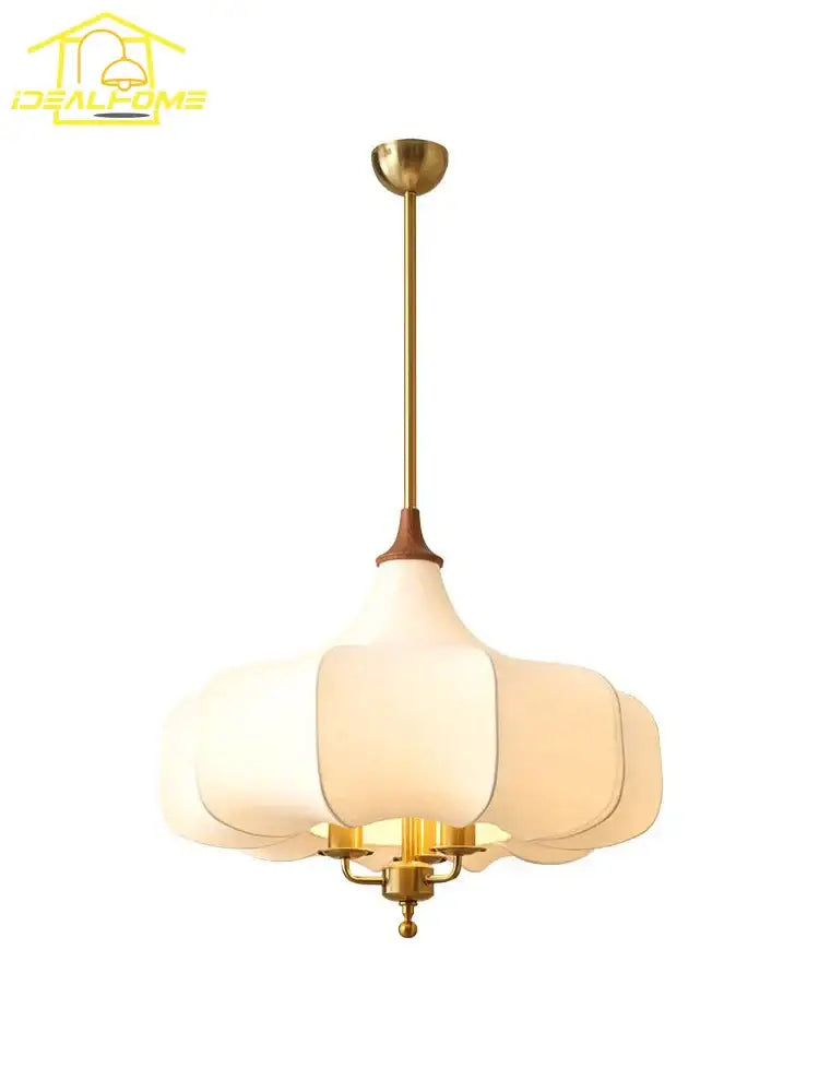 Gold-toned pendant lights with off-white translucent petal glass shade for french vintage bedroom decorbites design