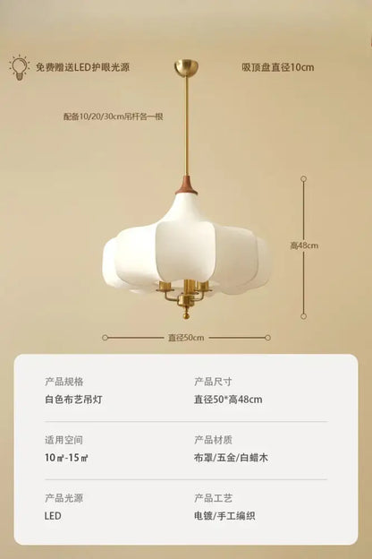 White fabric pendant light with gold-toned metal frame and wooden accents in decorbites french vintage bedroom style