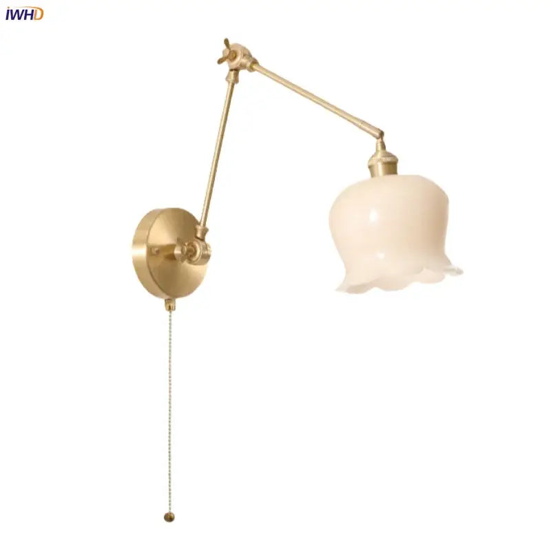 Gold-toned adjustable wall light with cream resin led fluted glass shade and brass articulated arm for bedroom decorbites cream resin