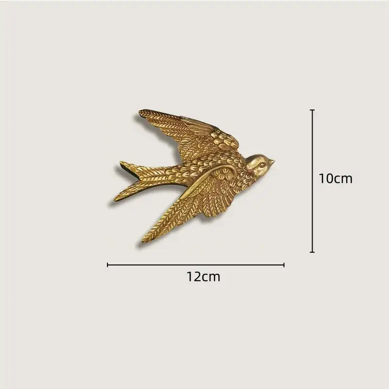 Golden swallow-shaped french vintage cupid wall decor with textured feathers and metallic finish in gold and wood frame