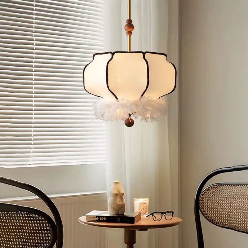 Delicate off-white french vintage fabric chandelier with black trim and cream feather fringe for dining room decorbites french vintage