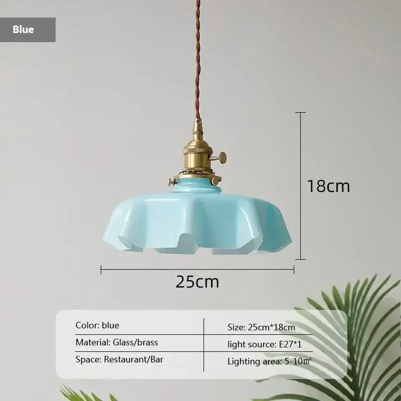 French vintage pendant light featuring a delicate light blue glass shade with brass fixture and braided cord for decorbites