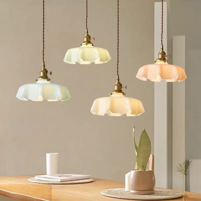 Three french vintage pendant lights with brass fixtures and pastel glass shades for kitchen island decorbites pendant light