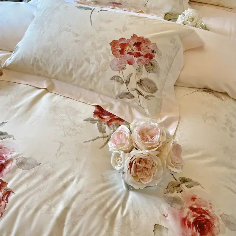 Cream-colored satin pillowcase with french vintage rose watercolor pattern in soft pink on egyptian cotton bedding set