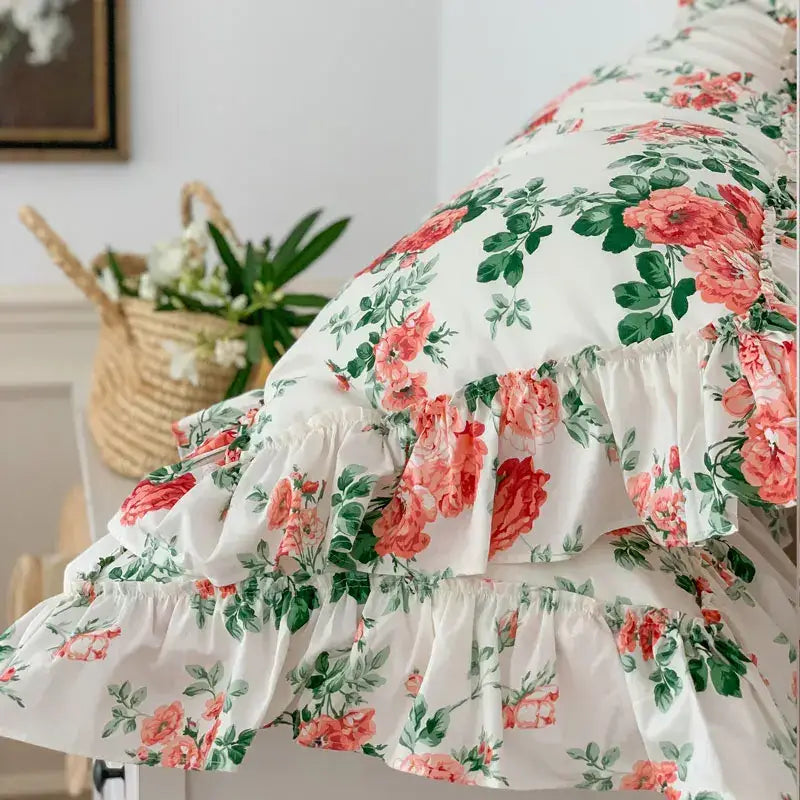 A white pillow sham from decorbites french vintage bedding set with coral rose print and lace ruffles for bedroom decor