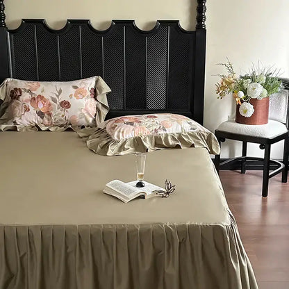 Beige satin bed skirt with ruffled hem and matching floral pillowcases in decorbites french vintage ruffles bedding set