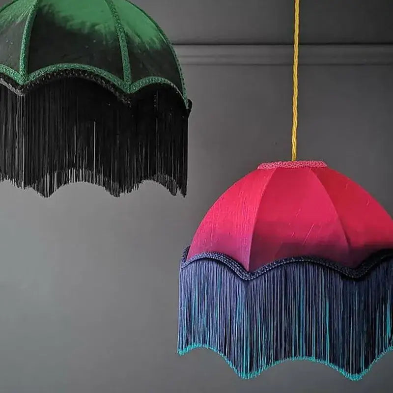 A vibrant pink and teal beauvamp tassel pendant light with velvet fabric and lace trim for living room use