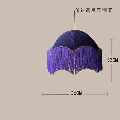 A deep purple velvet-textured beauvamp tassel pendant light with scalloped edge and cascading fringe for living room