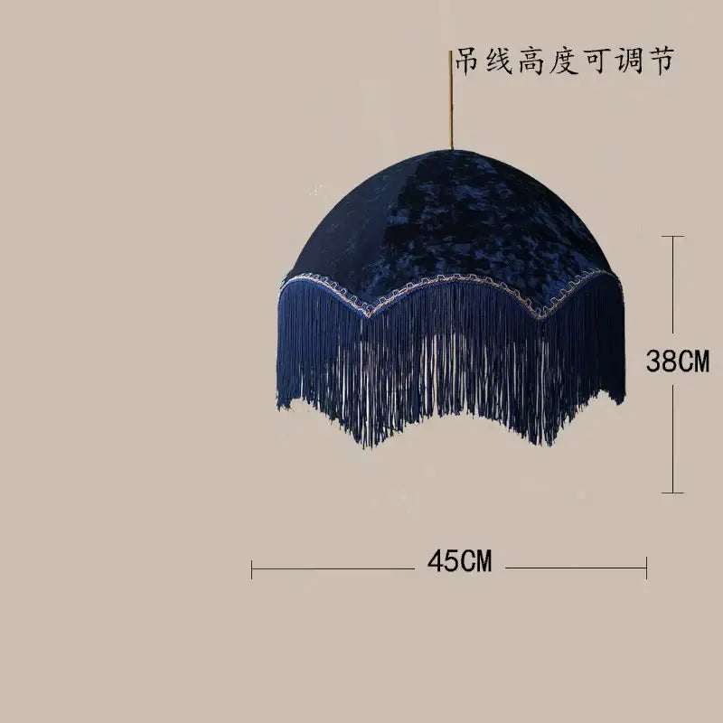 Deep navy velvet tassel pendant light with decorative fringe and adjustable hanging chain for living room use