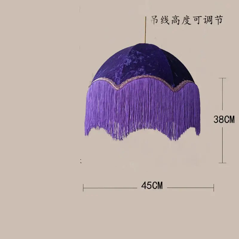 A plush purple velvet tassel pendant light with cascading fringe and decorative trim for living room use