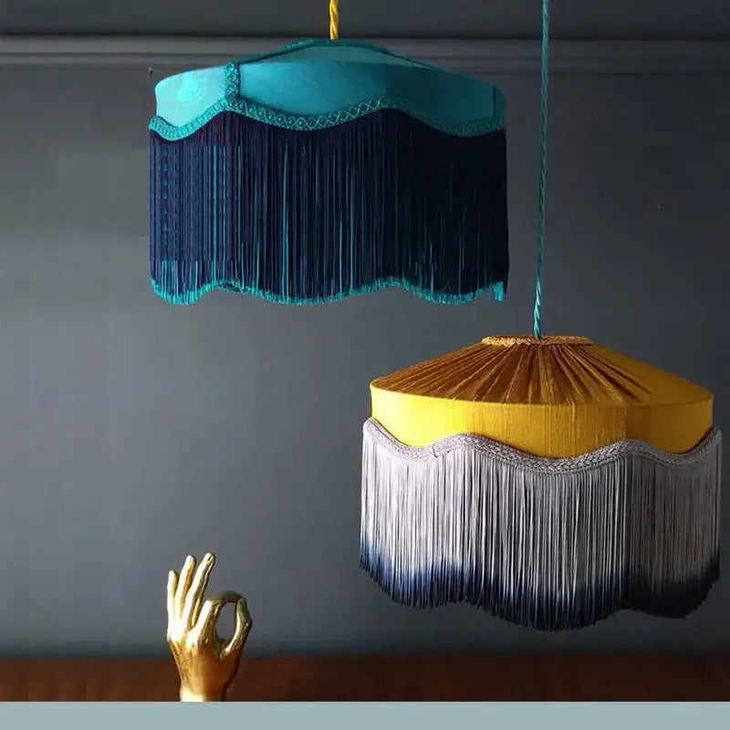 Two ornate french vintage beauvamp tassel pendant lights in teal and mustard with decorative fringe for living room use