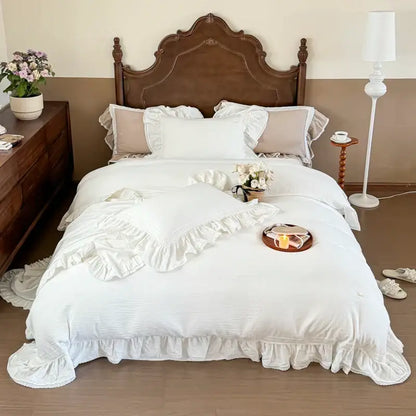 White ruffled cotton bedding set featuring double layer crinkle yarn with textured duvet and matching pillowcases