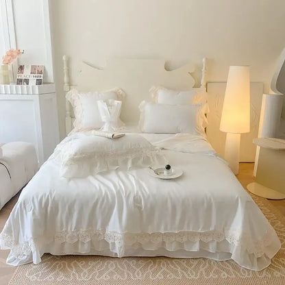 White lace-trimmed bedding set with ruffled edges and delicate floral embroidery decorbites french wedding lace