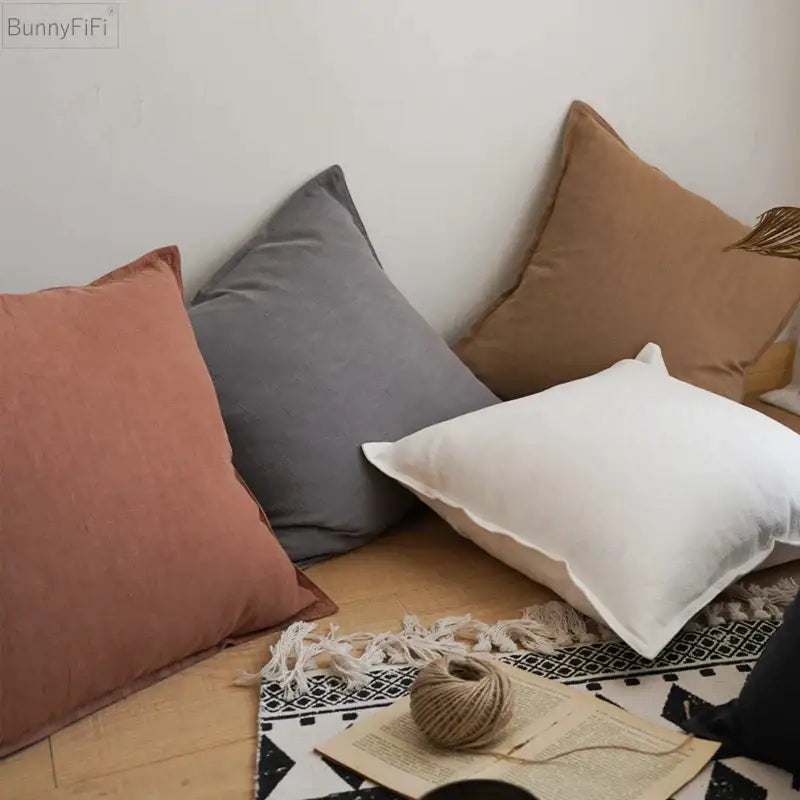 Soft earth-toned linen pillow cover in muted terracotta slate gray and cream white for decorbites linen decor