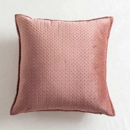 Soft blush pink quilted throw pillow with subtle dotted texture and neatly stitched edges in decorbites fringed velvet cushion cover