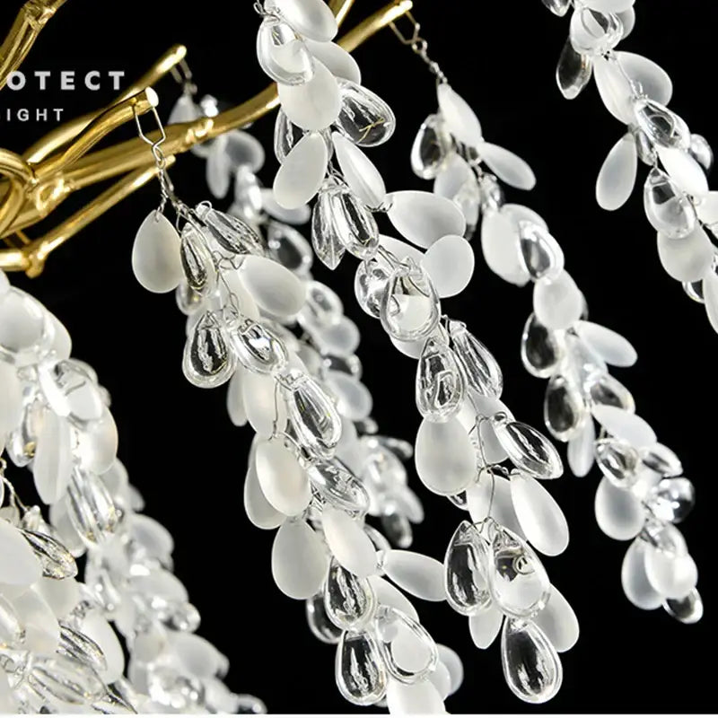 Elegant white and clear glass teardrop chandelier with frosted aluminum golden branch structure for dining room decorbites frosted aluminum