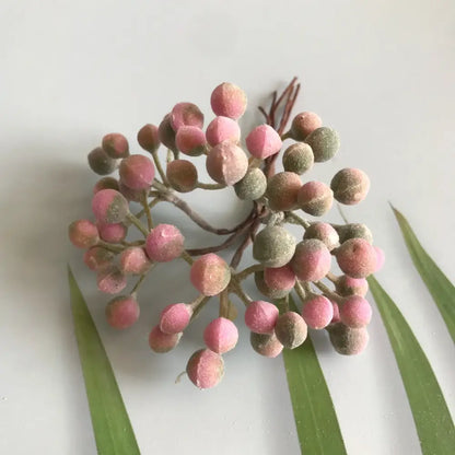 A frosted greenery berry stamen bundle with pink and muted green matte artificial berries for living room decorbites decor