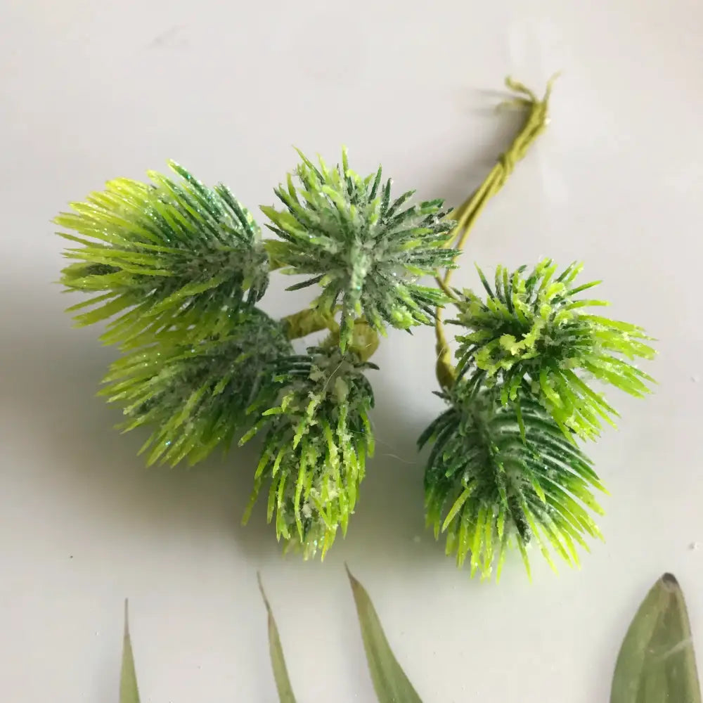 Frosted greenery berry stamen bundle with glittery textured artificial green pinecones and thin stems for decorbites greenery berry decor