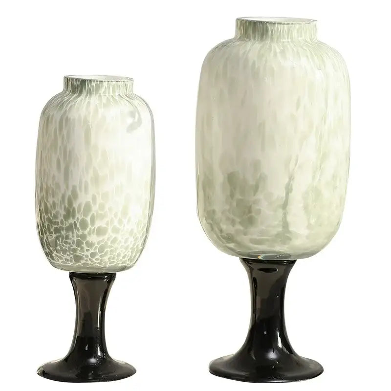 Two elegant frosted marbled dot texture glass vases in white and green on black pedestal bases for living room decorbites dot texture