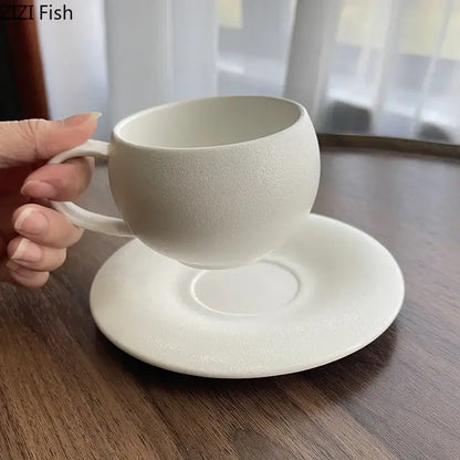 Minimalist white ceramic cup and saucer set with textured matte finish from decorbites frosted collection for dining room