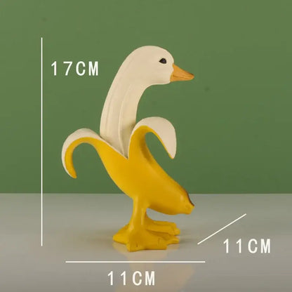 Whimsical white and yellow banana duck sculpture made of smooth plastic for living room decor