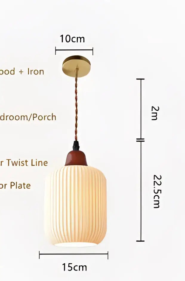 Cream-colored ribbed glass pendant light with brass-finished top and wooden accent for dining room use