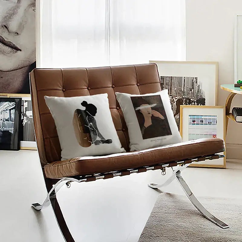 Brown leather barcelona chair with tufted back and chrome frame featured with decorbites geometric artist cushion cover