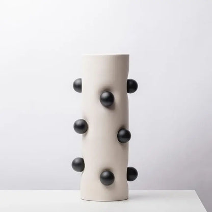 Cream-colored ceramic geometric ball vase with glossy black spherical protrusions for living room decorbites geometric decor