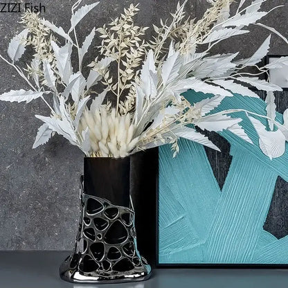 Black ceramic plated hollowed vase with glossy geometric base and silver accents for decorbites gold plated living room decor