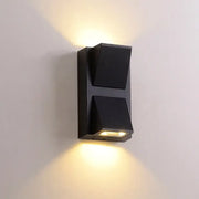 Geometric black led outdoor wall light with dual angled fixtures emitting warm illumination for bedroom decoration
