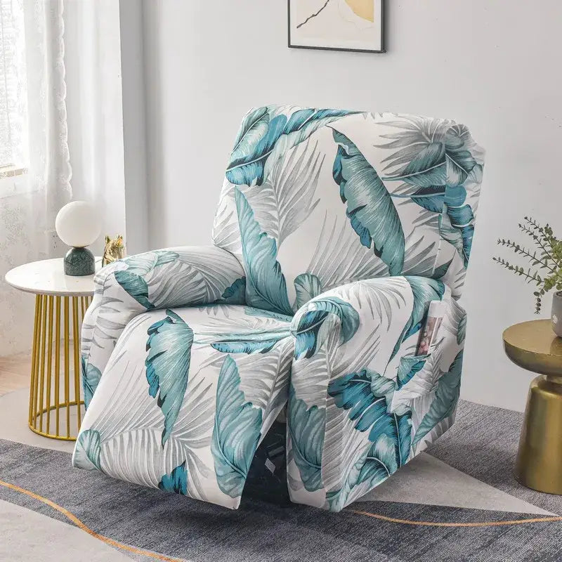 A cozy recliner with a vibrant teal and white tropical leaf patterned soft stretchy fabric cover for living room use
