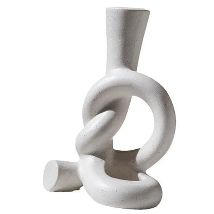 White ceramic candle stand with textured speckled finish and abstract knot design for home decor by decorbites ceramic knot