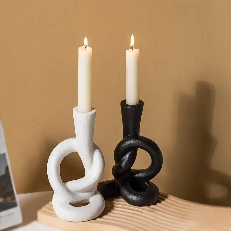 White and black ceramic knot candle stand with sculpted design for elegant home decor by decorbites ceramic knot