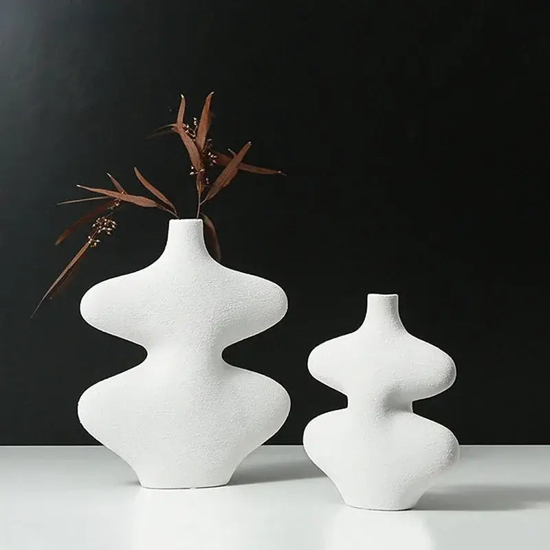 White ceramic vase set with modern sculptural organic curves and textured surfaces for decorbites geometric ceramic decor