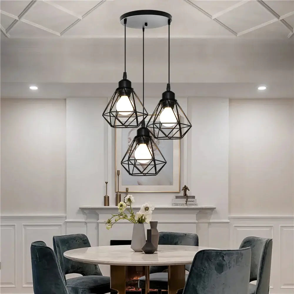 Black geometric iron frame pendant chandelier with modern industrial design hanging above dining table decorbites iron frame