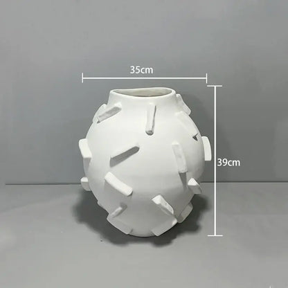 White ceramic geometric block ceramic vase with rounded body and rectangular tabs for green and beige living room decorbites decor