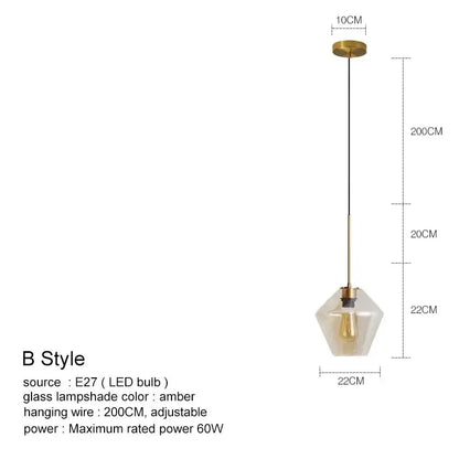 A modern pendant light with brass metal frame and amber geometric glass chandelier lighting for kitchen use
