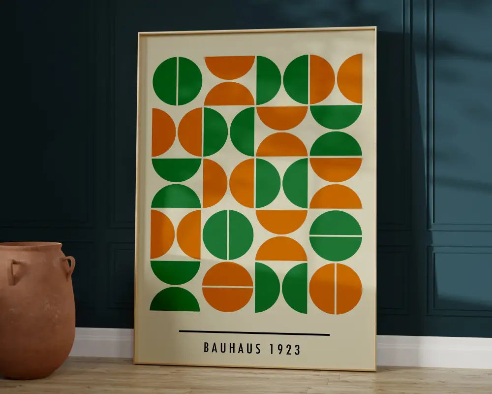 A framed bauhaus geometric canvas print featuring green and orange half-circles for home decor use