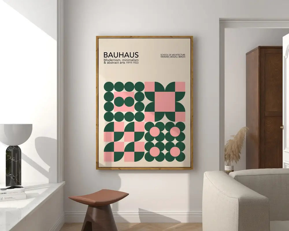 A framed bauhaus geometric canvas print in green and pink with a light wood frame for home decor by DecorBites™