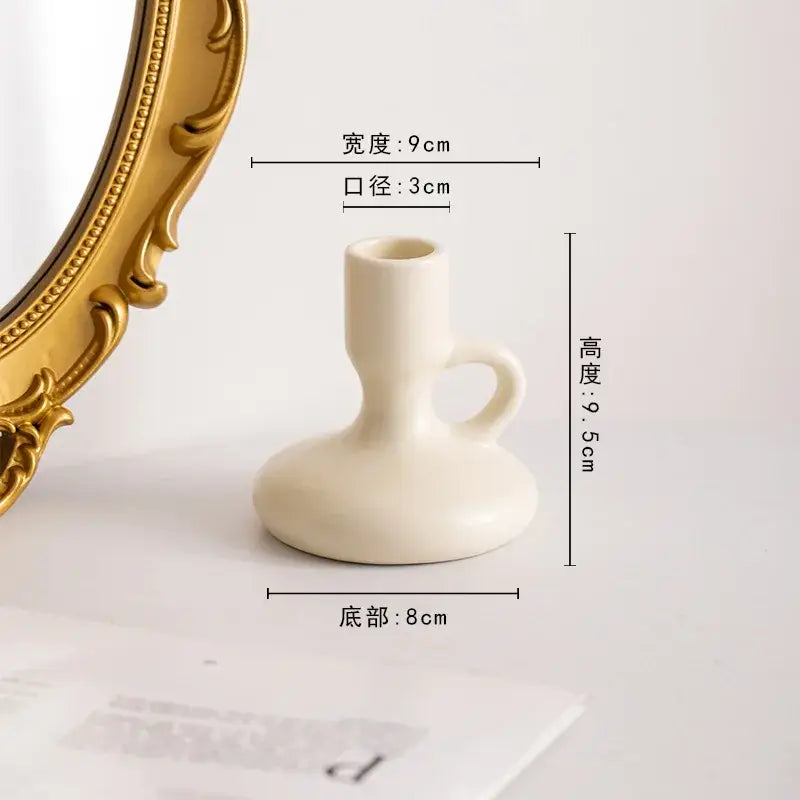 Cream-colored ceramic candle holder with handle and rounded base from decorbites geometric ceramic candle set for living room decor