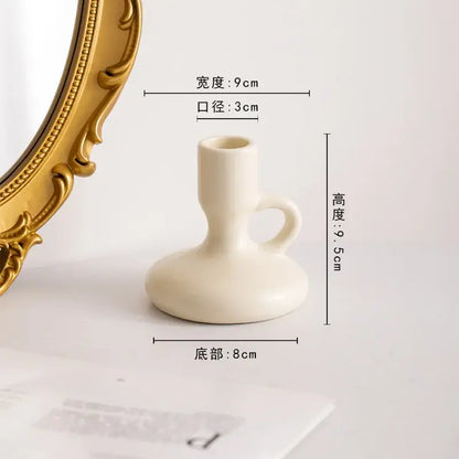 Cream-colored ceramic candle holder with handle and rounded base from decorbites geometric ceramic candle set for living room decor