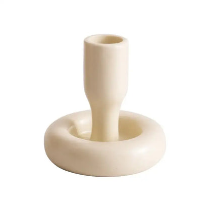 Cream-colored geometric ceramic candle holder with sleek minimalist design and circular base for living room decorbites decor