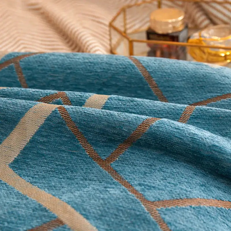 Teal textured decorbites geometric chenille cushion cover with beige and brown geometric pattern for living room decor