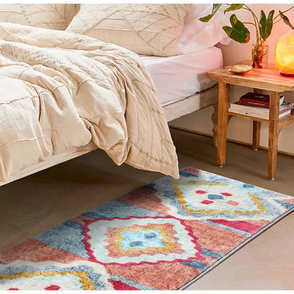 A rectangular plush decorbites boho runner rug with vibrant pink blue yellow and white geometric pattern for entryway use