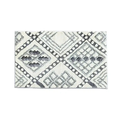 A plush off-white decorbites boho runner bath mat with black gray geometric diamond pattern for entryway use