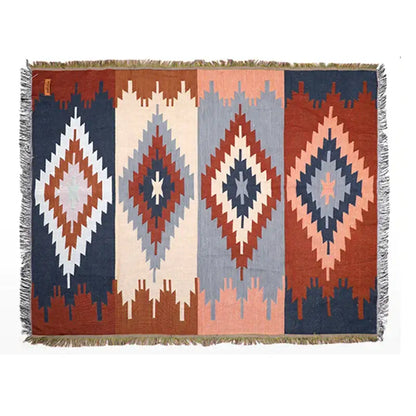 Rectangular decorbites geometric cotton knitted sofa blanket with navy terracotta cream and muted blue diamond patterns and fringed edges