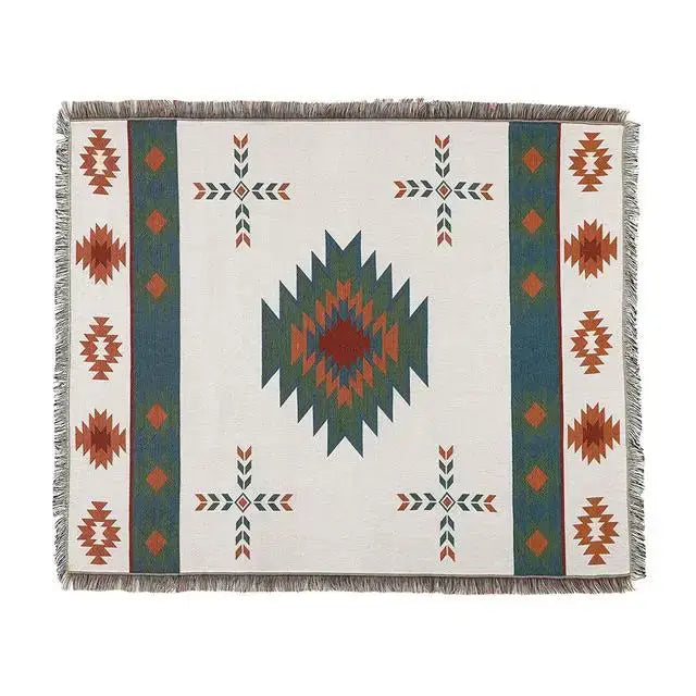 White woven geometric cotton knitted sofa blanket with teal rust dark green diamond pattern and fringed edges for decorbites