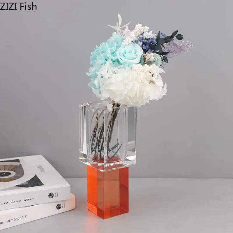 Clear acrylic crystal glass vase with orange geometric base featuring artificial flowers for living room decorbites decor