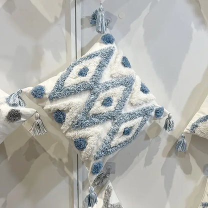A cozy cream pillow with decorbites geometric diamond tufted embroidery in blue and white for living room decor