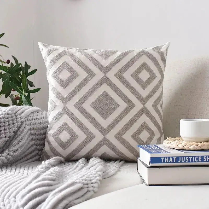 Square cushion cover with gray and white decorbites geometric embroidered diamond pattern on textured fabric for living room decor